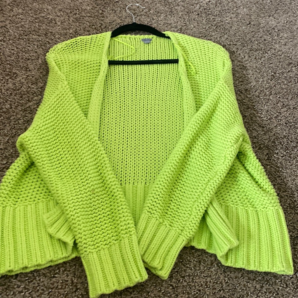 Bright green knitted pattern cardigan.